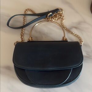 Melie Bianco Black and Gold Crossbody Bag with Chain Strap